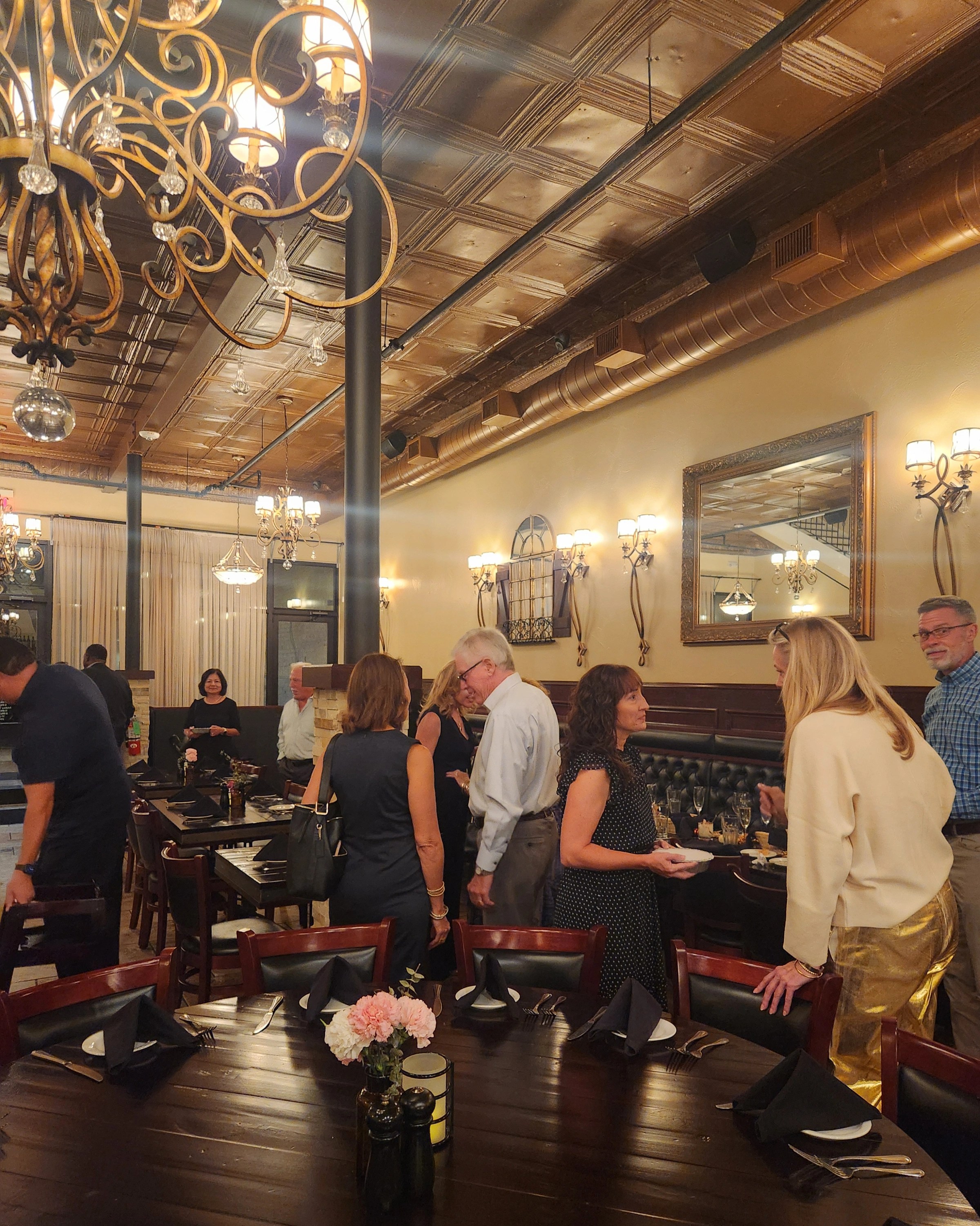 Downstairs image of 17 south. guests are enjoying the space one evening during a private event